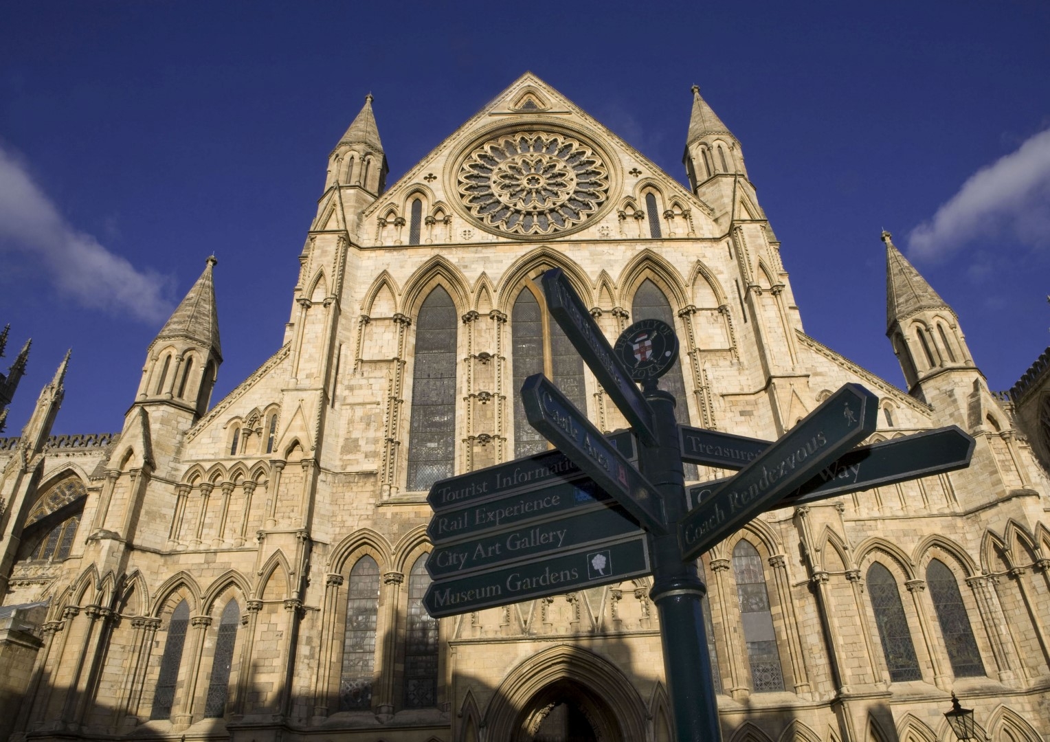 Ground view of York Minster showing directions through York (Large)